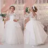 Ny Princess Ball Gown White Lace Flower Girls Klänningar för bröllop Billiga 2018 Tulle Belt Bow Knot Custom First Communion Dress Gown