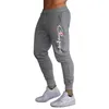 Stampa di lettere di marca Pantaloni da corsa per fitness muscolare Pantaloni sportivi da allenamento in cotone da uomo traspiranti con bocca sottile e casual He223S