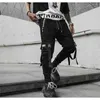 Wiosna Hip Hop Joggers Mężczyźni Czarny Harem Spodnie Multi-Pocket Wstążki Człowiek Spodnie Dysfunda Streetwear Casual Mens Pant 210714
