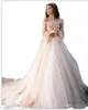 A Case da sposa a maniche lunghe in tulle di tulle da abiti da sposa boho berta berta