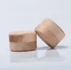 Petite boîte de rangement en bois ronde à la main
