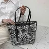 Store Handbag Discount Online Export 2023 New Factory Wholale Women's Trend Letter Bag Texture One Shoulder Portable High-capacity Tote