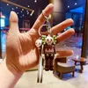 Favor BX007 Fashion KAWS Doll Designer Keyring Keychain Sesame Carra de rua Acessórios da cadeia de chave