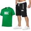 الصيف أزياء الرجال 2 قطعة مجموعة رياضية ماركة NKIC عارضة قصيرة الأكمام طباعة 100٪ القطن الأبيض تي شيرت + السراويل السراويل الدعاوى