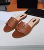 Real Leather Flat Slippers Fashion Letters Hollow Sewn Sandals Summer Exhibition Party Beach Shoes Designer Shoes Delivery Box 35-45