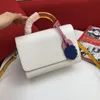 New Arrivals high quality Twist mid-size handbag Shoulder Bags Glass handle and colorful brand pendant Removable leather strap size23*17*9.5cm