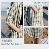 Ruos de faixa feminina PLUS 2 Peças conjuntos de mulheres xadrez roupas casuais de manga curta de verão calça toneloe calça coreana ladra de escritório coreana shorts