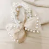 Nuovo temperamento coreano piccola fragranza fiocco in pizzo imitazione perla elastico corda per capelli accessori per capelli da donna per ragazza di moda