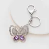 Ny Fashion Crystal Butterfly Keychain Glitter Rhinestone Metal Key Ring För Kvinnor Mode Chic Bag Hängsmycke Ryggsäck Tillbehör G1019