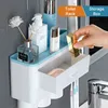 Magnetisk adsorption Inverterad tandborstehållare Automatisk tandkräm Squeezer Dispenser Storage Rack Badrum Tillbehör Hem 211224