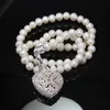 Thomas White Zircon-Paved Freshwater Pearl Halsband med öppen Locket Hjärta Hängsmycke, European Fine Smycken För Kvinnor Ts N309
