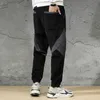 Осенняя зима мода моды мужчины джинсы свободные подходящие сращенные дизайнер повседневные кормуры грузовые брюки уличные одежды хип-хоп пробежки брюки