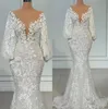 2022 Ny långärmad sjöjungfru bröllopsklänningar Sheer Neck Full Lace Blommig Beaded African Trumpet Fishtail Beach Aso Ebi Bridal Gowns