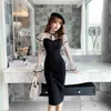 Film aristocratic wind horn sleeve agaric side white gauze of tall waist wave point perspective sexy dress cultivate one's mo 210602