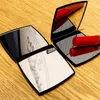 Moda nero compatto specchi cosmetici di lusso mini specchio a mano strumento di trucco di bellezza da toilette portatile pieghevole sfaccettato 2Face mirrore1600057