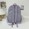 Mochilas escolares de color sólido para mujer, morral con colgante bonito para niños y niñas, mochilas de lona de gran capacidad para ordenador portátil 2021267h