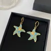Luxury Dangle & Chandelier Retro beauty head starfish Crystal Earrings full of diamond super flash personality niche design Medusa Earrings