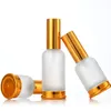 Bouteilles de parfum d'huile essentielle de lotion de pompe en verre givré (pulvérisateur) avec le chapeau en bronze d'or 20ml 30ml 50ml