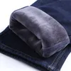 Winter New Men's Warm Slim Fit Jeans Business Fashion Thicken Denim Trousers Fleece Stretch Brand Pants Black Blue 210317