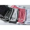 Femmes Broderie Lettres Runner Shorts Stretch Ceinture Contraste Garnitures Formation Rétro Shorts 210611