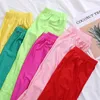 Legginsy damskie YGYEEG damskie jednokolorowe fluorescencyjne błyszczące spodnie elastan Shinny Capris elastyczność spodnie typu Casual Girl Sport