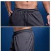 Nouveaux pantalons de sport BINTUOSHI hommes avec poches zippées Joggings hommes pantalons pantalons de fitness prix usine conception experte qualité dernier style statut d'origine