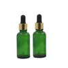 Garrafa de óleo essencial verde Matéria Borracha preta Borracha de ouro brilhante Anel de prata vazio Embalagem de embalagem de embalagem de embalagem de vidro vials 5ml 10ml15ml 20ml 30ml 50ml 100ml