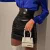 Kjolar 2021 mode sexig hög midja dragkedja pu mini kjol för kvinnor streetwear blcak viks kort smal lokomotiv