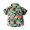 Europeiska och amerikanska barn sätter grossist sommar mode pojkar kortärmad ananas tryckt t-shirt + blommiga casual byxor två styck set barn strand