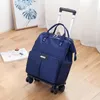 Duffelväskor 2021 Wheeled Bag Travel Women Trolley Ryggsäck med hjul Oxford Stor kapacitet Rullande Bagage Väska