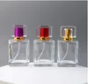 高級50mlの正方形のガラスの詰め替え可能な香水瓶の空のカラフルな化粧噴霧器ポンプのスプレーの瓶