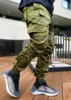 Мужские брюки Осень 2021 Светоотражающая полоска дизайн Jogger Men Свободный фитинг Негабаритные работы Брюки Tide Drawstring Щека