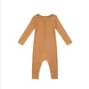 Spädbarnsknappar Knapp Kläder Pojke Romper Långärmad Nyfödd Tjej Elasticitet Jumpsuits Pure Färg Barn Bodysuit Baby Boutique Kläder Wear Outside