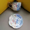 Keramiska Retro Cups Saucer Set Porcelana Phnom Penh Asymmetrisk Blå och Vit Porslin Teacup Kaffe eftermiddag Teaset