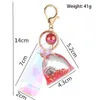 Nouveau acrylique GLOW LUCKET SAC liquide Keychain Creative Quicks Sand Bouteille Key Chain Femme Sac Pendant Car Courteillet Trinket Lovely Gift G8409199