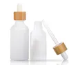 Botella cuentagotas de vidrio blanco ámbar esmerilado 15ml 30ml 50ml con tapa de bambú Botellas de aceite esencial de madera de 1 oz