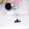 Pompon noir lettre porte-clés Alphabet anglais porte-clés dégradé paillettes résine voiture porte-clés anneaux accessoire femmes sac à main breloques