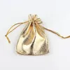 50 stks / partij sieraden verpakking goud folie doek trekkoord kerstcadeau verpakking cadeau tassen7x9cm bruiloft tassen pouches