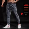 Pantaloni da corsa BINTUOSHI Pantaloni sportivi elastici traspiranti Tasche con cerniera da uomo Pantaloni da allenamento Pantaloni da jogging Pantaloni da fitness per uomo