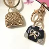 10pieces / lot Exquisite Charme Mode Keychain Kreative Handtasche geformt Design Keychain Bogen Kristall Geldbörse Tasche Schlüsselanhänger Schlüsselanhänger Weibliche Geschenk