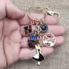 المينا KC مطلية بالذهب Keychain أليس في بلاد العجائب الأرنب الأرنب ساعة إبريق بوكر أسلوب العرقية اليدوية حلقة رئيسية هدية BZ059-76 G1019