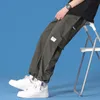 Мужские брюки грузовые весенние досуг сгруппировали корейский Гонконгский стиль прямой ноги свободно девять центов хаки