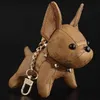 Diseñador Animal pequeño perro creativo llavero accesorios llavero PU cuero letra patrón coche llavero joyería regalos 264K