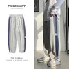 Streetwear Men Casual Sweatpants 2021 Mens Sportkläder Joggare Striped Pants Fashion Male Skinny Slim Monterade Gym Harem Byxor Y0927