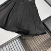 Luxury Pearl Chain Belt Decoration Black Ball Gown Kjolar Kvinnor 2022 Sommar Runway Design Tassel Bottom Elegant Lady Midi Kjol