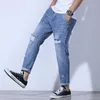 Jeans masculinos Alongamento masculino e fino calças de harém Blue azul claro Aumento casual rasgado