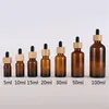 1 uns Amber Glass Dropperflaskor för eterisk olja med bambu keps 15 ml 20 ml 30 ml 100ml