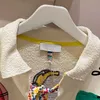 女性用パーカーニッチトレンド2021夏の新しい緩い刺繍プルオーバーシャ​​ツカラーレースアップウールセーター女性のファッション