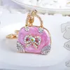 10pieces / Lot Exquisite Charm Fashion Keychain Kreativ handväska formad design Keychain Bow Crystal Purse Väska Keyring Nyckel Kedja Kvinna gåva