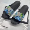 Designer kvinnor män tofflor blomma mönster högsta utgåva sommarstrand platt sandaler svart gröna platt plattformskor original fabrik bra pris